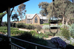Chapel ( Dining space with BBQ, Kitchenette, tables and chairs). View from King Suite balcony